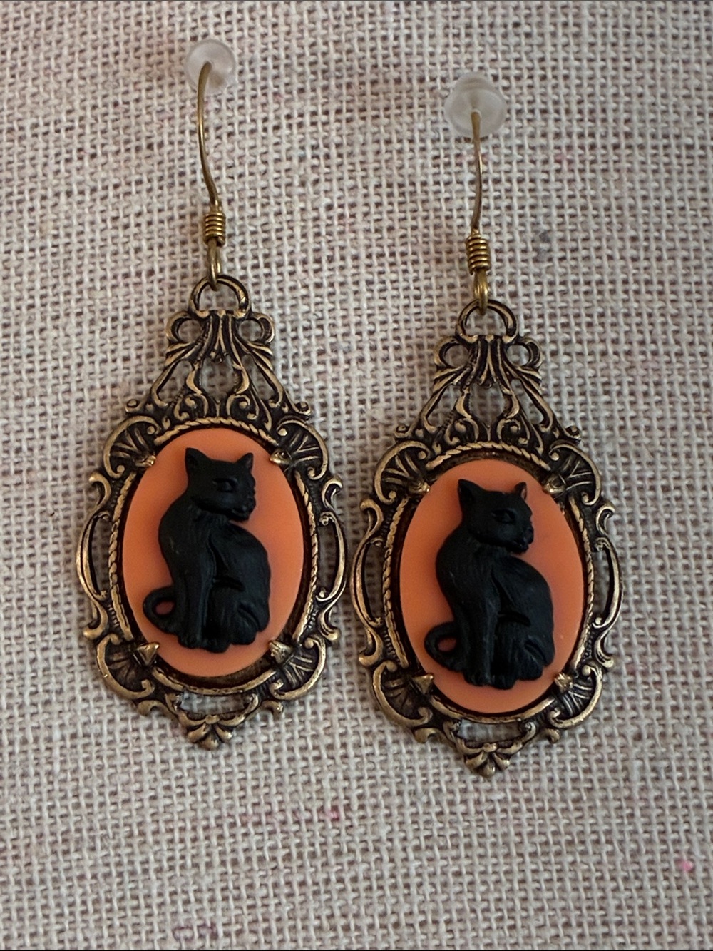 Black cat relief resin cameo dangle earrings set in brass tone metal